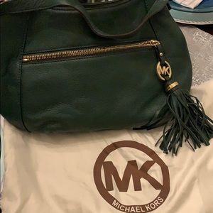 Dark green Michael Kors bag.